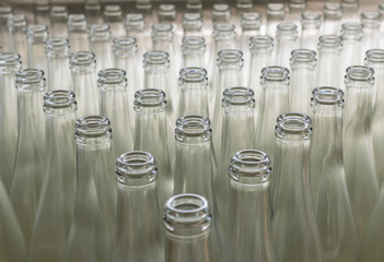 pile of empty transparent glass bottles
