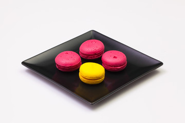 Traditional french colorful macarons on the plate