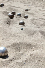 Fototapeta na wymiar Playing of bocce in the sand