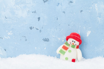 Christmas snowman in snow