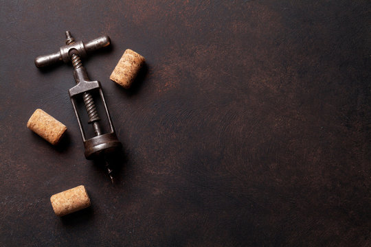 Vintage corkscrew and wine corks