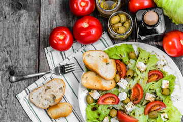 Homemade salad, vegetable greek salads, top view, vegetarian dish