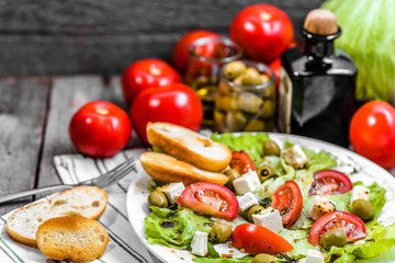Homemade salad, vegetable greek salads with toasted bread