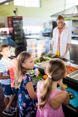 Fototapeta premium Cooker serving children 