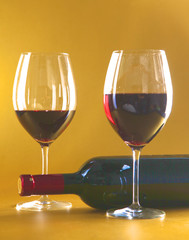wine bottle and glass on a table