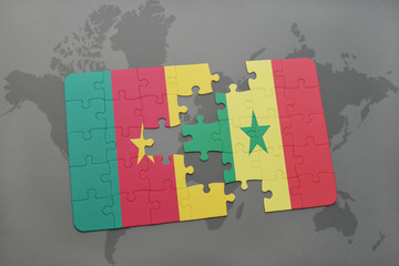 puzzle with the national flag of cameroon and senegal on a world map.