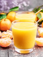 Fresh juice of ripe mandarins in a small glass