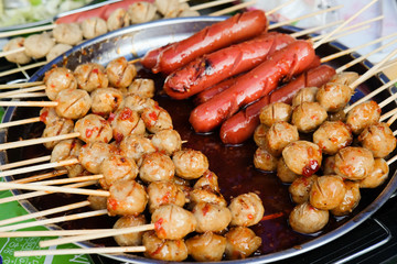 Grilled meat ball and sausage with spicy sauce