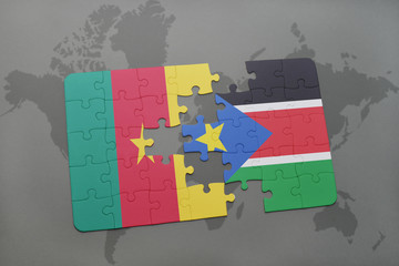 puzzle with the national flag of cameroon and south sudan on a world map.