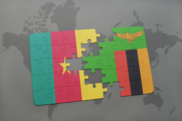 puzzle with the national flag of cameroon and zambia on a world map.