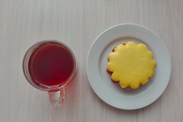 amazing tasty biscuits with cream and a cup of tea
