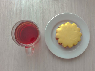 amazing tasty biscuits with cream and a cup of tea