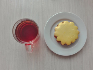 amazing tasty biscuits with cream and a cup of tea