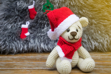 crochet teddy bear in a red Christmas hat.amigurumi handmade.