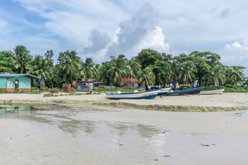 Fototapeta na wymiar Corn Island, Nicaragua – August 17, 2016: beach view with people around. General travel imagery