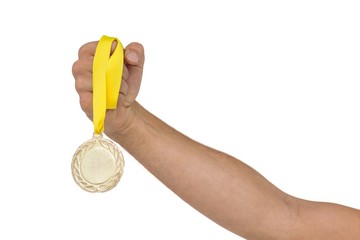 Fototapeta na wymiar Athlete holding gold medal after victory