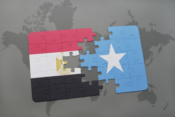 puzzle with the national flag of egypt and somalia on a world map.