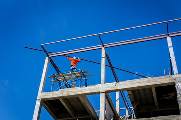 Naklejka premium Construction workers working on high risk