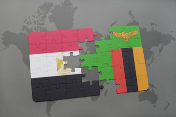 puzzle with the national flag of egypt and zambia on a world map.