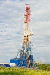 Land oil drilling rig blue sky