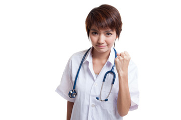 Portrait of confidence young female doctor hold fist.