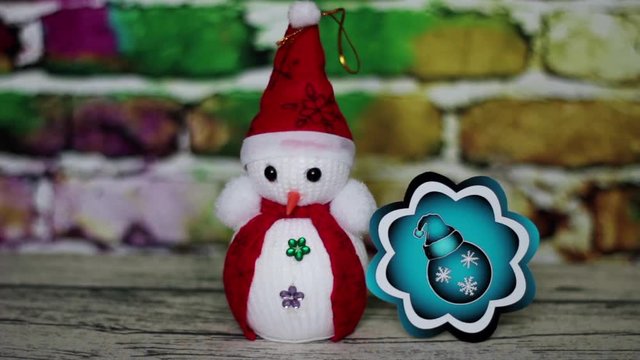 Snowman and a blue Christmas ball
