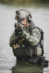 Military team crossing the river under fire