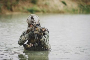 Naklejka premium Portrait of a ranger in the battlefield with a gun