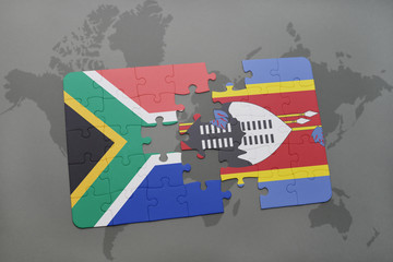 puzzle with the national flag of south africa and swaziland on a world map.