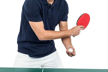 Mid section of athlete man playing table tennis