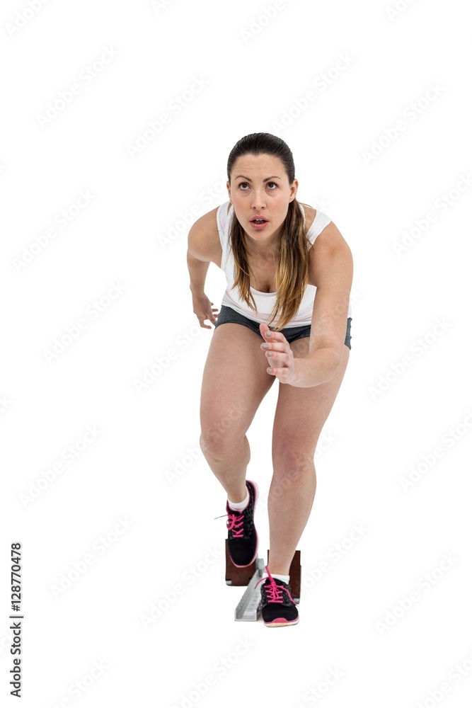 Wall mural athlete woman in ready to run position