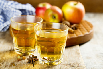 Hot cider with spices in glasses