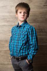 Portrait of a boy on the background wall