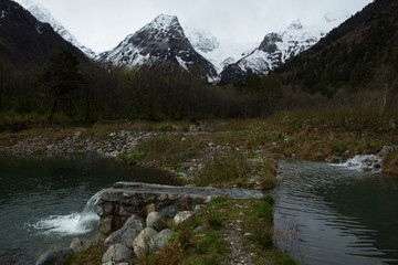 Two lakes and mountains in the snow. North Caucasus. North Ossetia. Russia.