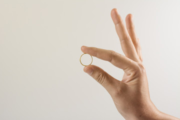 Gold ring on hand isolated