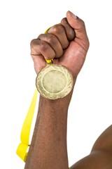 Fototapeta na wymiar Athlete holding gold medal after victory