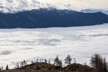 Fototapeta na wymiar Sea Of Fog Above Lake Millstatt View To Goldeck In Carinthia Austria