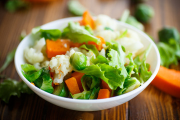 salad of lettuce, cauliflower and Brussels sprouts with a pumpkin