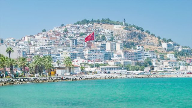 Turkish Resort Destination of Kusadasi Turkey Vibrant Seaside Setting with Buildings and Flags against a Mountain Hill during Sunny Weather