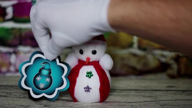 Snowman and three Christmas balls