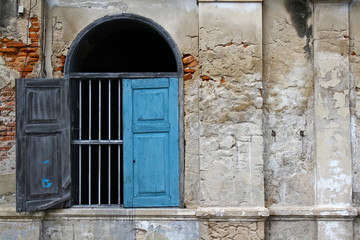 The old vintage window with old wall at urban