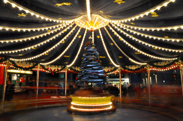 Blurry light background with long exposure of carousel rotating