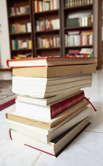 Book in a pile over floor