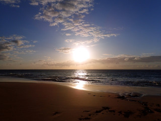Naklejka na ściany i meble Sunset on Pahohaku Beach
