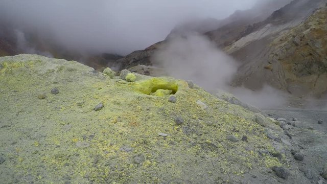 Sulfur gases emitted from a fumarole of Mutnovsky volcano. Kamchatka, Russia.