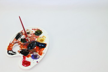 White artist's palette with brush
