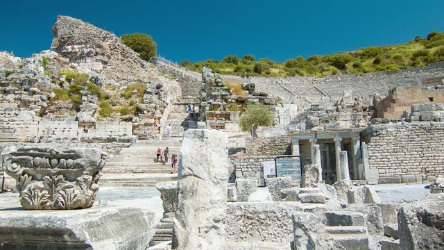 Selcuk Turkey Ephesus Great Theater Entrance at the Foot of the Mountain with Tourists Exploring the Ancient Roman Stadium during Hot and Sunny Weather
