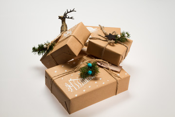 Christmas decoration. Boxes with Christmas gifts. Beautiful packaging. Gift wrap with pictures. Handmade.