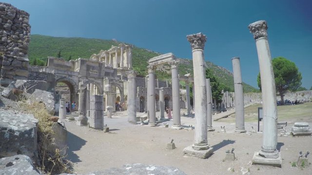 Ephesus Ancient Marble Columns and Pillars with Tourists Visiting the Historical Roman City in the Hills of Selcuk Turkey during a Sunny Summer Day