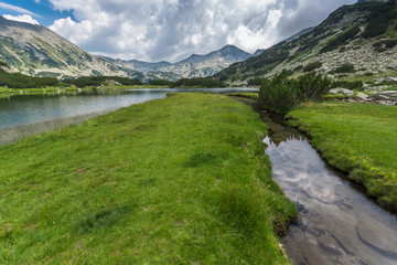 Naklejka na ściany i meble Amazing Landscape of Banderishki Chukar Peak and reflection in Muratovo lake, Pirin Mountain, Bulgaria